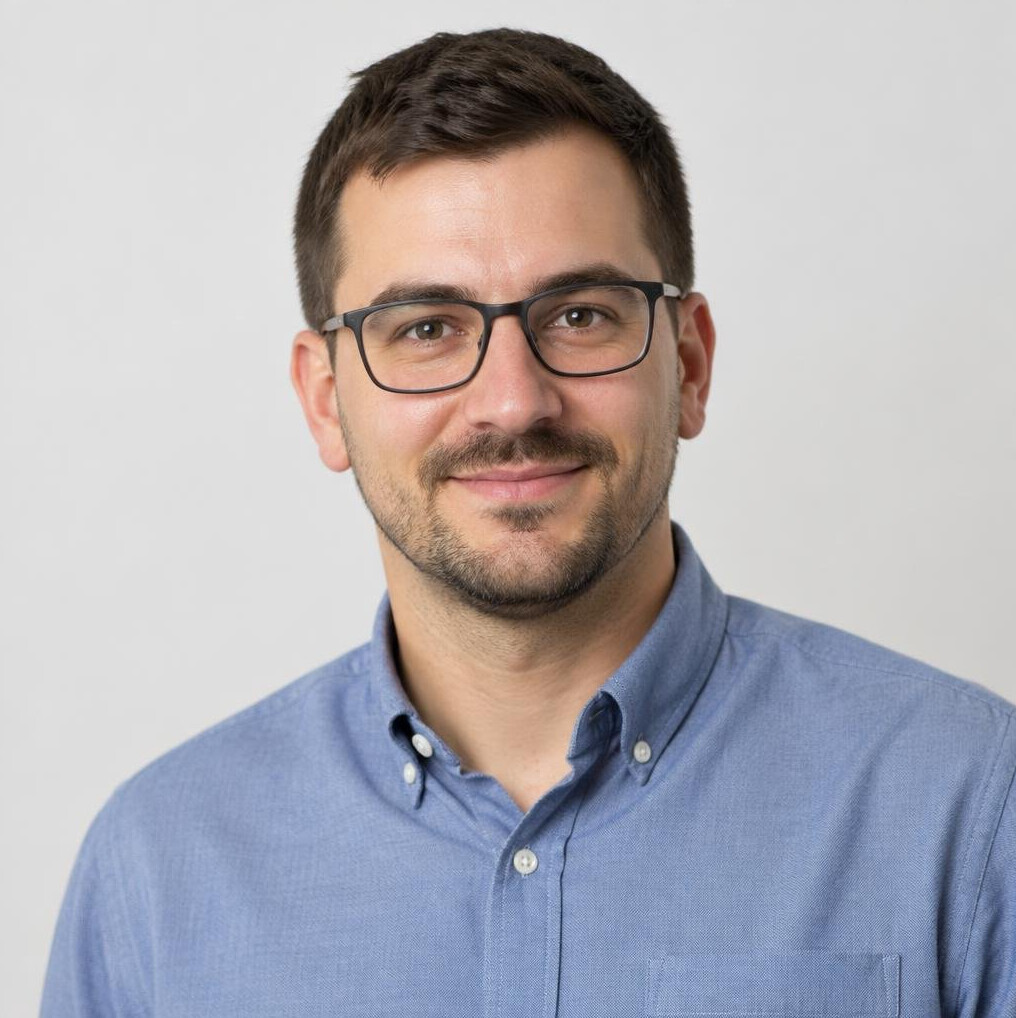 Studio portrait of a Croatian man mentor with glasses