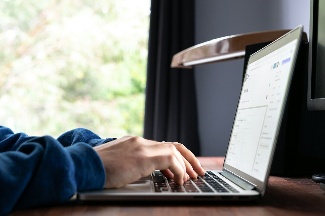 beginner typing code on laptop