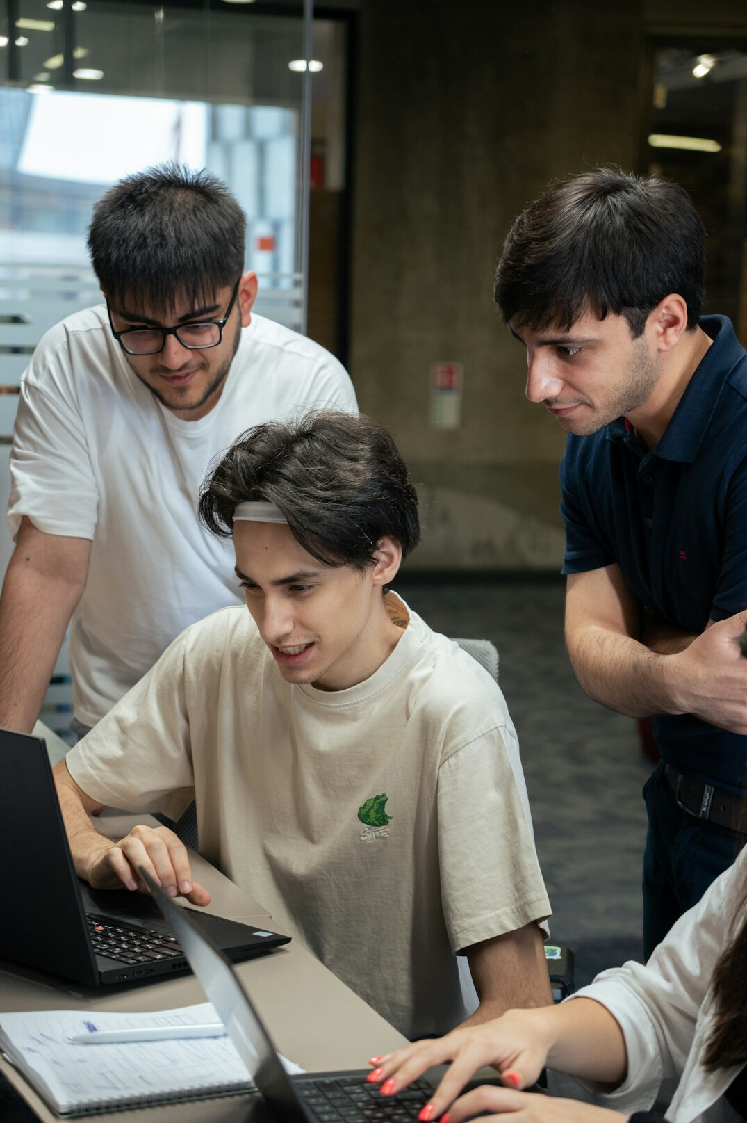 group of students discussing code